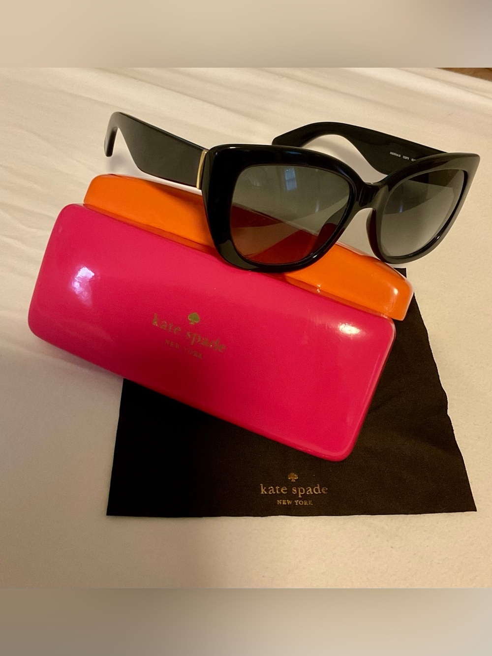 kate spade Black Cat-Eye Sunglasses with Hot Pink and Orange Cases